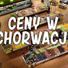 Kolorowy supermarket z owocami i warzywami. Napis "CENY W CHORWACJI" sugeruje, że to miejsce, gdzie można sprawdzić aktualne ceny produktów spożywczych.