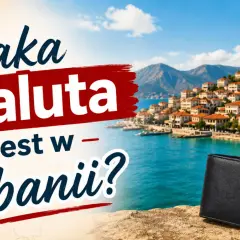 Jaka waluta w Albanii? Czarny portfel na tle malowniczego wybrzeża i albańskiej flagi.