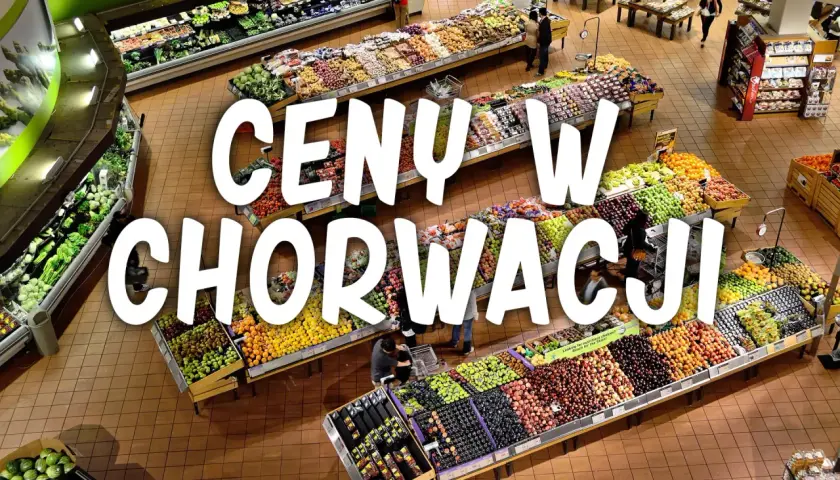 Kolorowy supermarket z owocami i warzywami. Napis "CENY W CHORWACJI" sugeruje, że to miejsce, gdzie można sprawdzić aktualne ceny produktów spożywczych.