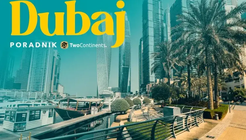 Dubaj: czy do Dubaju trzeba paszport? Widok na nowoczesne drapacze chmur, palmy i łodzie w marinie.