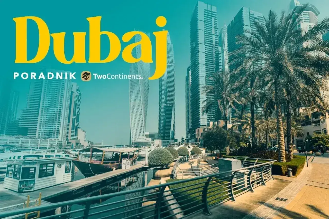 Dubaj: czy do Dubaju trzeba paszport? Widok na nowoczesne drapacze chmur, palmy i łodzie w marinie.